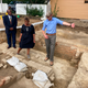 Reginald F. Davis, from left, pastor of First Baptist Church, Connie Matthews Harshaw, a member of First Baptist, and Jack Gary, Colonial Williamsburg’s director of archaeology, stand at the brick-and-mortar foundation of one the oldest Black churches in the U.S. on Oct. 6, 2021, in Williamsburg, Va. Archaeologists in Virginia began excavating three suspected graves at the site on Monday, July 18, 2022, commencing a months-long effort to learn who was buried there and how they lived.